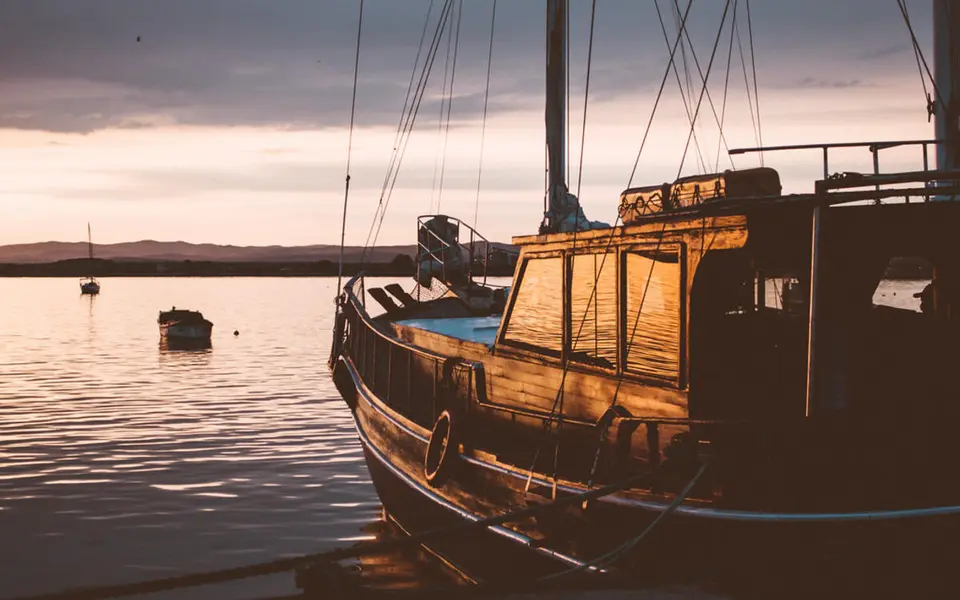A dhow on the water at sunset
