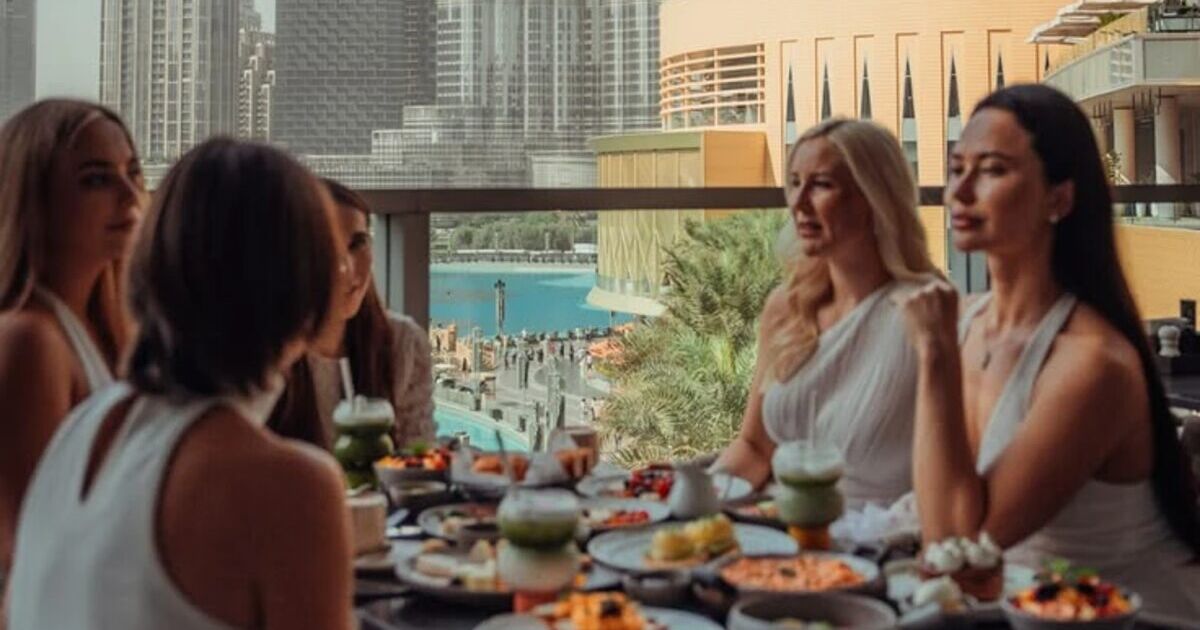 Friends sharing a brunch on a terrace in downtown Dubai
