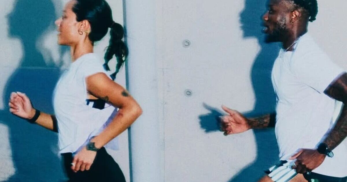 Two people running side by side